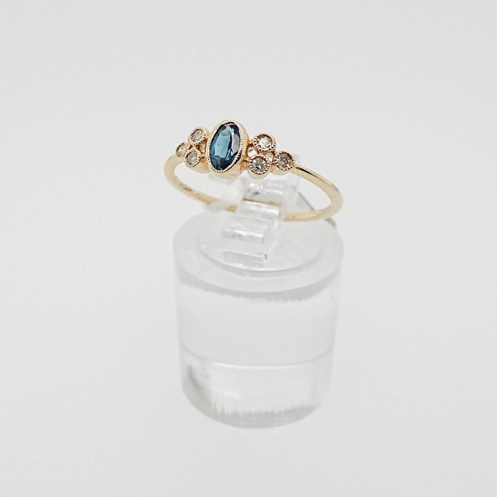 Oval London Blue Topaz Ring with Diamond Accents - Acadian Estates & CustomRing